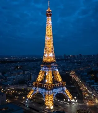 Eiffel Tower illuminated at night in Paris