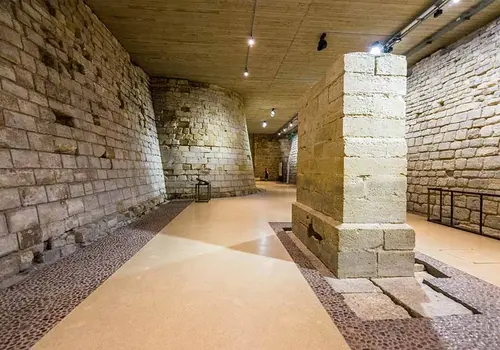 Louvre Museum Medieval stone foundations preserved beneath the Louvre Museum, showing ancient fortress walls in an underground gallery